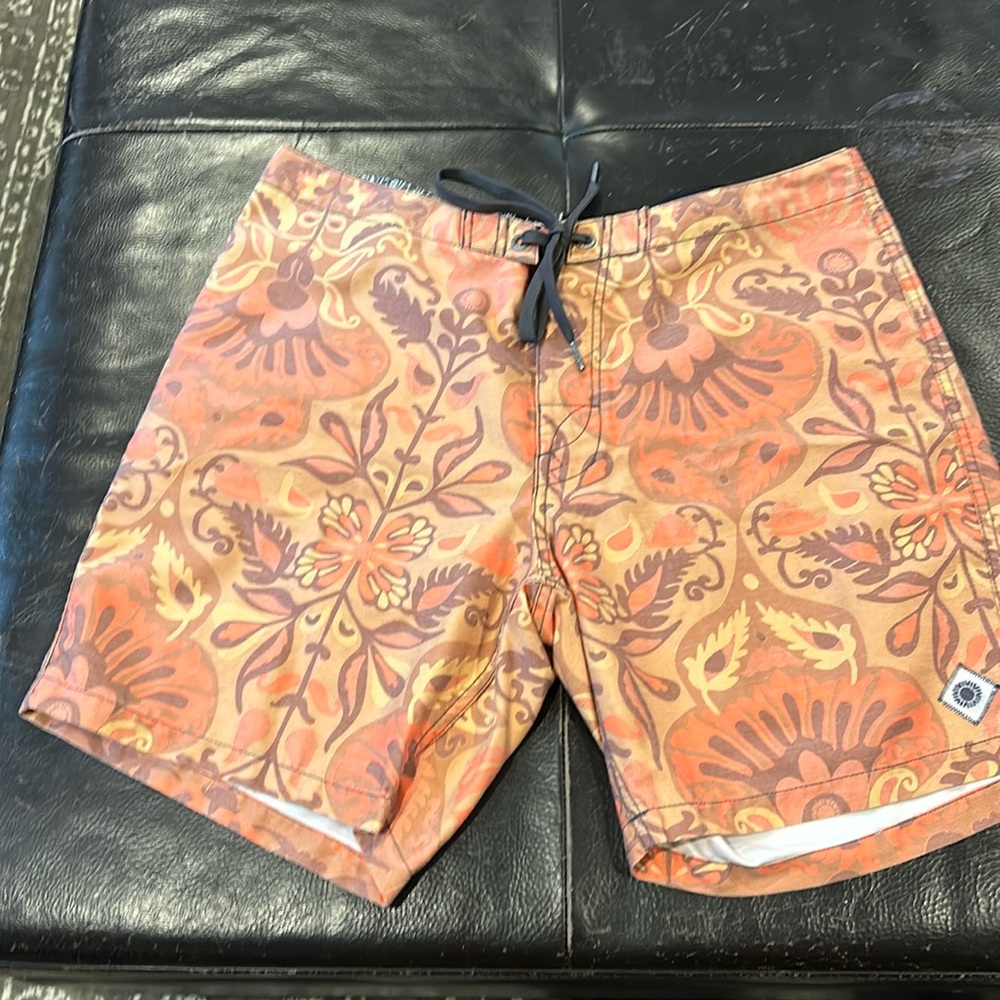Rhythm board shorts, orange with a paisley type pattern